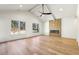 Bright living room with vaulted ceilings, wood floors, a ceiling fan, and a tiled fireplace at 372 Karen Dr, Alpharetta, GA 30009