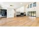 Expansive living space with fireplace, hardwood floors and multiple windows at 372 Karen Dr, Alpharetta, GA 30009