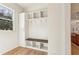 Well-organized mudroom with built-in storage, bench seating, and natural light at 372 Karen Dr, Alpharetta, GA 30009