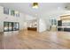 Bright and open-concept space with hardwood floors, connecting the living and kitchen areas at 372 Karen Dr, Alpharetta, GA 30009