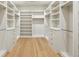 Organized walk-in closet with custom shelving, drawers, and ample storage space at 372 Karen Dr, Alpharetta, GA 30009