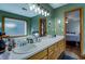 Spacious bathroom featuring double sinks, vanity and window over the soaking tub at 3891 Kraddle Creek Dr, Covington, GA 30014