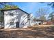 Exterior view of the house featuring a well-maintained backyard and deck at 1887 King Charles Sw Rd, Atlanta, GA 30331