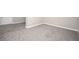 Finished basement featuring gray plush carpeting and a connecting tiled room at 1887 King Charles Sw Rd, Atlanta, GA 30331