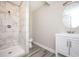 Modern bathroom featuring tiled shower and contemporary vanity at 1887 King Charles Sw Rd, Atlanta, GA 30331