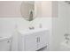 Bright bathroom with modern vanity, brushed nickel hardware, and updated fixtures in a renovated space at 1887 King Charles Sw Rd, Atlanta, GA 30331