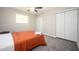 A bedroom featuring a double door closet and a plush bed, perfect for relaxation at 1887 King Charles Sw Rd, Atlanta, GA 30331