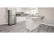 Bright kitchen featuring stainless steel appliances, white cabinetry, and granite countertops at 1887 King Charles Sw Rd, Atlanta, GA 30331