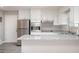 Well-lit kitchen with stainless steel appliances, white cabinets, and granite countertops at 1887 King Charles Sw Rd, Atlanta, GA 30331
