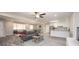 An open-concept living room features a neutral color scheme and is adjoined by the kitchen at 1887 King Charles Sw Rd, Atlanta, GA 30331