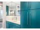 Elegant bathroom with blue cabinets, marble countertops, dual sinks, and modern fixtures at 845 Spring Nw St # 502, Atlanta, GA 30308