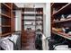 Walk-in closet with custom wood shelving and drawers, providing ample storage space at 845 Spring Nw St # 502, Atlanta, GA 30308