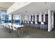 Modern common area with sleek bar, communal table, and floor to ceiling windows at 845 Spring Nw St # 502, Atlanta, GA 30308
