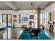 Elegant dining room featuring a glass table and modern decor with a view to the balcony and living area beyond at 845 Spring Nw St # 502, Atlanta, GA 30308