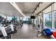 Modern gym with treadmills and workout equipment with floor to ceiling windows at 845 Spring Nw St # 502, Atlanta, GA 30308
