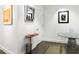 Hallway featuring polished concrete floor, white walls with artwork, and modern furniture at 845 Spring Nw St # 502, Atlanta, GA 30308