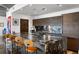 The kitchen features a large granite island with bar seating, sleek wood cabinets, and stainless steel appliances at 845 Spring Nw St # 502, Atlanta, GA 30308