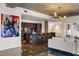 Modern kitchen featuring a large granite island with bar seating, sleek wood cabinets, and stainless steel appliances at 845 Spring Nw St # 502, Atlanta, GA 30308