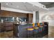 Modern kitchen with granite countertops, sleek wood cabinets, stainless steel appliances, and bar seating at 845 Spring Nw St # 502, Atlanta, GA 30308