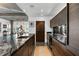 Beautiful kitchen with a granite island, wood cabinets, and stainless steel appliances with dining and living area background at 845 Spring Nw St # 502, Atlanta, GA 30308