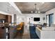 Cozy living room with a large sectional sofa and modern decor with a spacious kitchen in the background at 845 Spring Nw St # 502, Atlanta, GA 30308