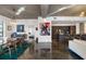 Open-concept living space showcasing the dining area, kitchen, and living room with a large sectional sofa at 845 Spring Nw St # 502, Atlanta, GA 30308