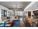 Bright and airy living room with a large sectional sofa and modern decor with a spacious kitchen in the background at 845 Spring Nw St # 502, Atlanta, GA 30308