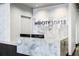 Modern Lobby featuring a marble reception desk and a backdrop with 'Midcity Lofts' displayed at 845 Spring Nw St # 502, Atlanta, GA 30308