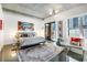 Relaxing main bedroom with a large bed, stylish decor, balcony and city views at 845 Spring Nw St # 502, Atlanta, GA 30308