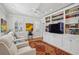 Stylish living room featuring custom built-ins, comfortable seating, and bright, natural light at 1030 Eulalia Ne Rd, Atlanta, GA 30319