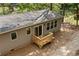 An eye-level view of the backyard of the house displaying its wooden porch and scenic surroundings at 160 Vandiver Rd, Canton, GA 30114