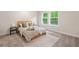 Cozy bedroom featuring neutral tones, soft carpet, and ample natural light at 160 Vandiver Rd, Canton, GA 30114