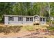 Charming home with gray siding, black shutters and a well-manicured lawn, perfect for suburban living at 160 Vandiver Rd, Canton, GA 30114
