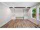 Bright living room with built-in shelving and large windows at 160 Vandiver Rd, Canton, GA 30114