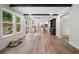 Open-concept living space with wood floors and views of the kitchen and outdoor scenery at 160 Vandiver Rd, Canton, GA 30114