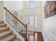 Bright foyer with hardwood floors, staircase, and a view of the front door at 4316 Constellation Blvd, Snellville, GA 30039