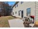 Back patio with seating and grill, perfect for outdoor gatherings and enjoying the backyard view at 4316 Constellation Blvd, Snellville, GA 30039