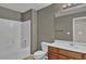 Bathroom featuring a combination shower and tub with tiled flooring at 1384 Stone Bay Sw Dr, Atlanta, GA 30331