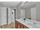 Bathroom features a double sink vanity and wood flooring at 1384 Stone Bay Sw Dr, Atlanta, GA 30331