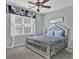 Comfortable bedroom featuring a large window and stylish decor at 1384 Stone Bay Sw Dr, Atlanta, GA 30331