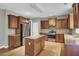 Spacious kitchen featuring stainless steel appliances, wood cabinets, island and hardwood floors at 1384 Stone Bay Sw Dr, Atlanta, GA 30331