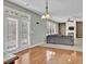 Cozy living room featuring double doors leading outside, a ceiling fan, and a fireplace at 1384 Stone Bay Sw Dr, Atlanta, GA 30331