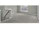 Bright, empty room with neutral tones with a large window at 1384 Stone Bay Sw Dr, Atlanta, GA 30331