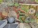 Aerial view of the property featuring a landscaped backyard with a fire pit and a pond at 1884 Point River Dr, Duluth, GA 30097