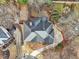 Overhead view of a home showcasing the roof, landscaping, and outdoor firepit at 1884 Point River Dr, Duluth, GA 30097