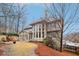 Rear view of the home showcasing large windows and a sunroom, blending indoor/outdoor living at 1884 Point River Dr, Duluth, GA 30097