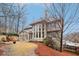 Expansive backyard featuring floor-to-ceiling windows, sunroom, and a well-manicured lawn at 1884 Point River Dr, Duluth, GA 30097