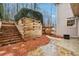 View of a wooden retaining wall, stairs and a stone-paved area of the yard at 1884 Point River Dr, Duluth, GA 30097