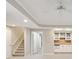 A finished basement with a kitchenette featuring white cabinets, a sink, and space for entertaining at 1884 Point River Dr, Duluth, GA 30097