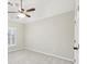 This bedroom includes neutral walls, carpet floors, a ceiling fan, and a window with natural light at 1884 Point River Dr, Duluth, GA 30097